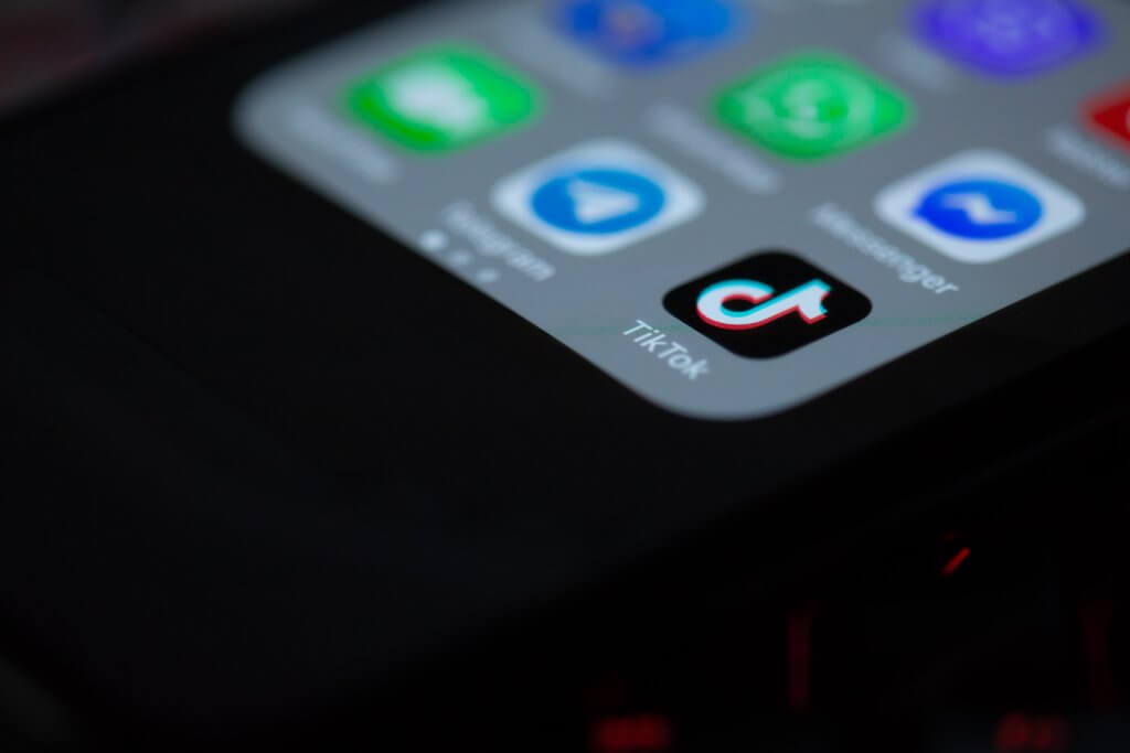 Image of a phone opened to the TikTok profile | How To Advertise On TikTok