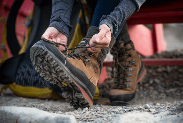 Someone lacing up their Meindl boot.